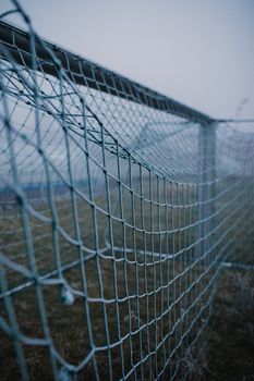 Gray Metal Fence Near White Wall