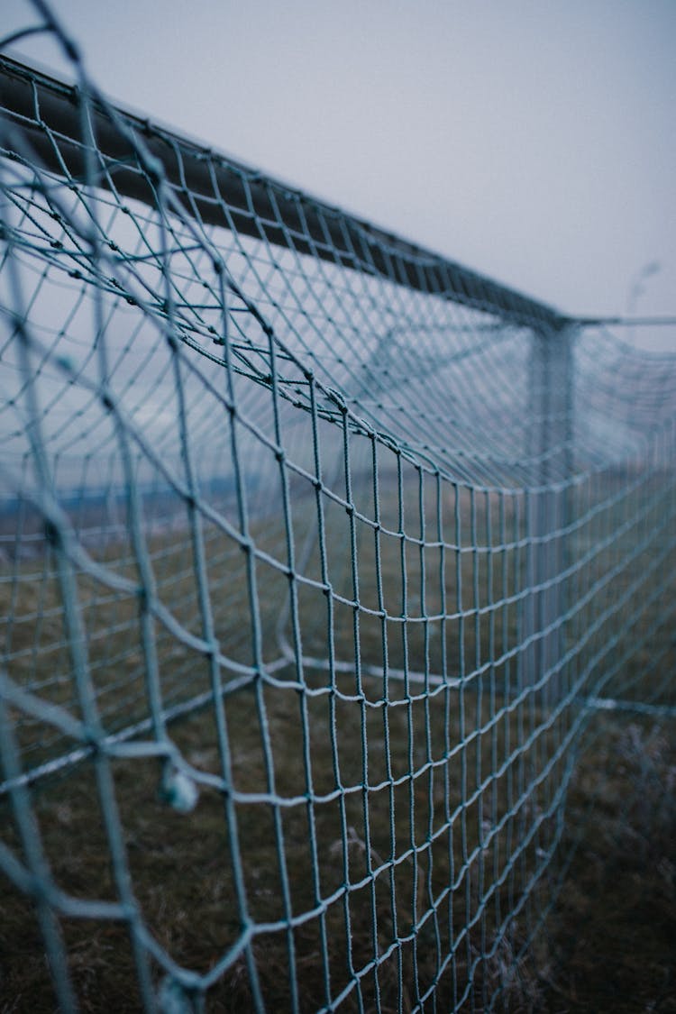 Close-up Photo Of A Football Net On A Gloomy Day