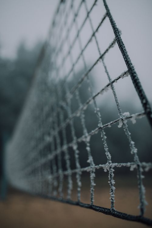 Free Close-up view of frost-covered net outdoors, offering a chilly winter theme with high detail. Stock Photo