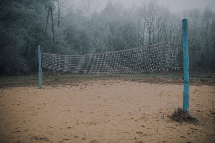 Unpaved Volleyball Court In Forest