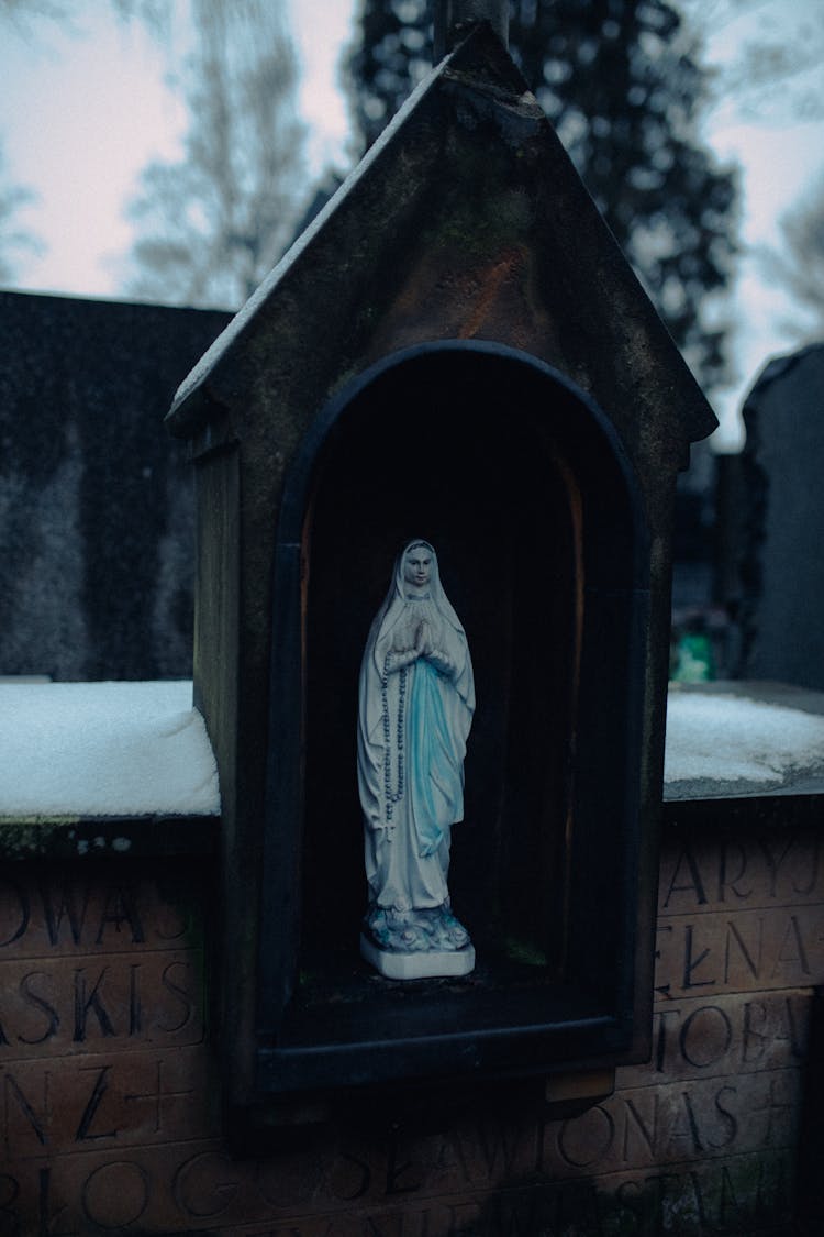 Virgin Mary Statue On A Casing