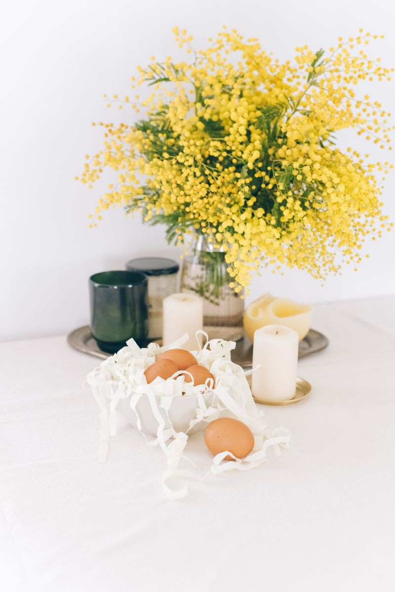 Pastel Easter table setting with decorated eggs