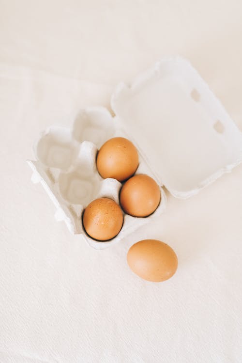 Brown Eggs on White Carton