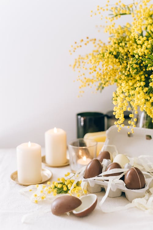 Brown Eggs And Lighted Candles On Table