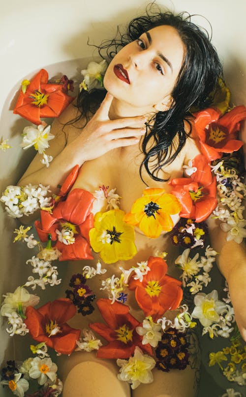 Free Woman in Bathtub Full of Flowers Stock Photo