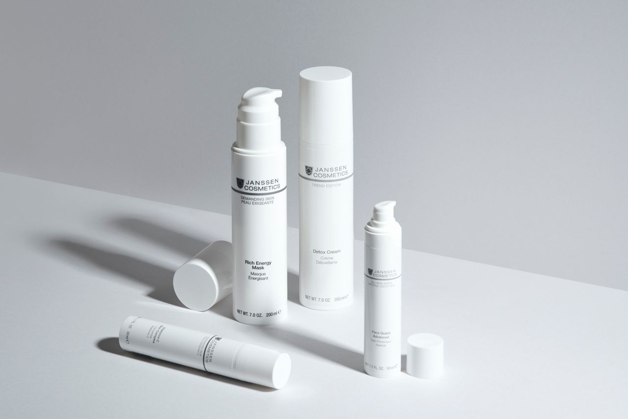 Minimalistic display of clinical skincare bottles against a clean white backdrop