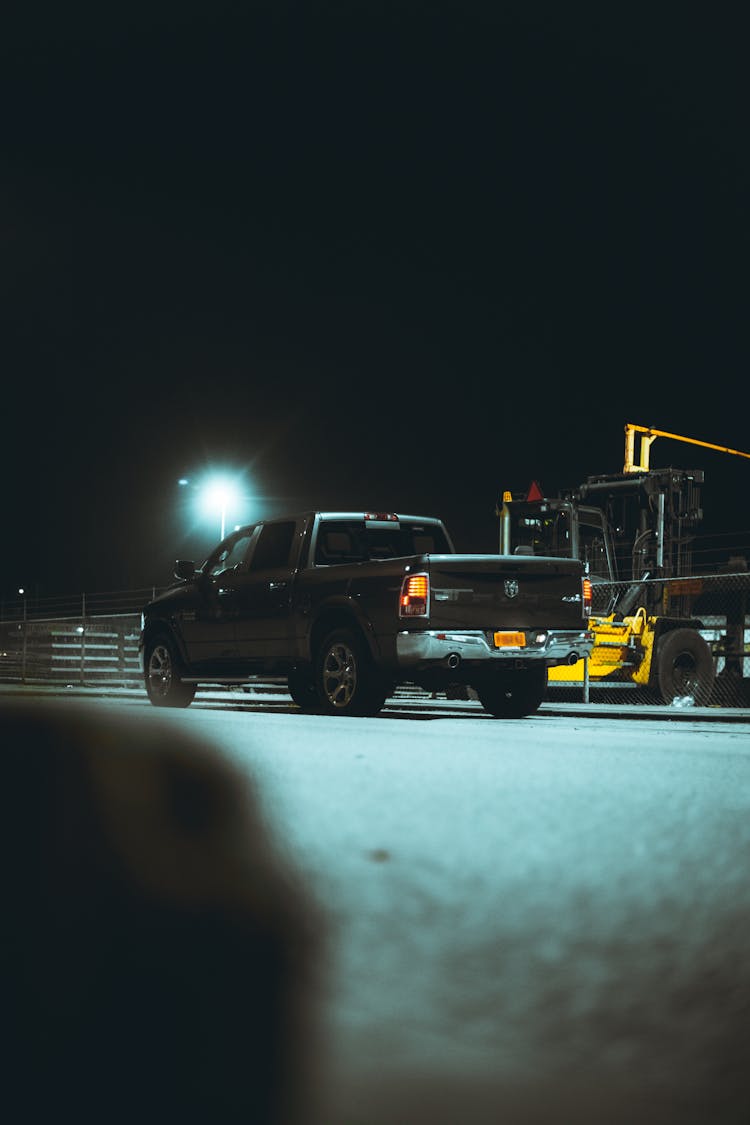 Black Pickup Truck On Road During Night Time