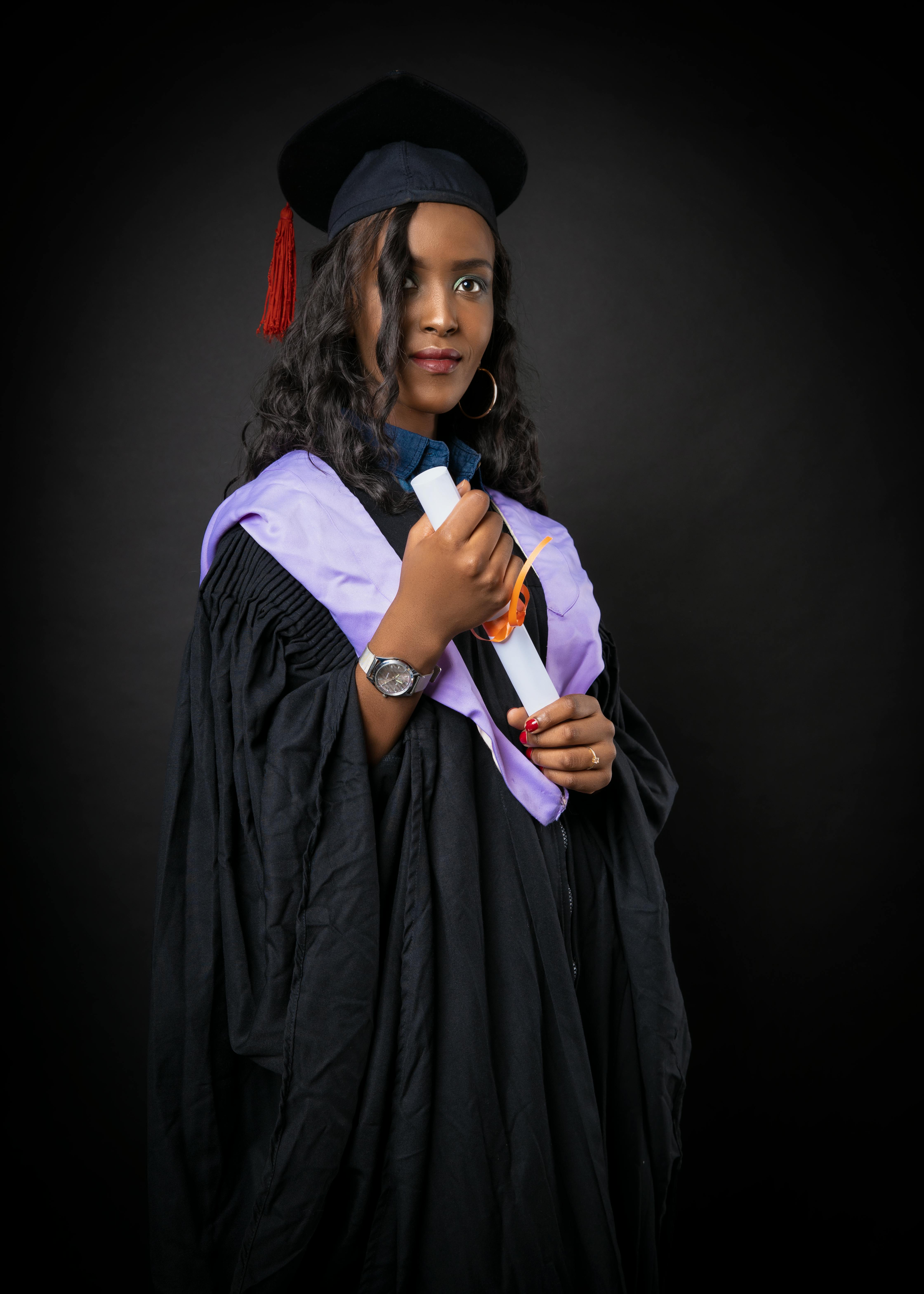 Free Photo | Group of young afro american female student dressed in black graduation  gown. campus as a background