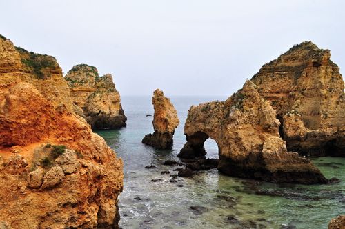 Free Explore the breathtaking rocky formations and natural arches of this stunning seaside landscape. Stock Photo