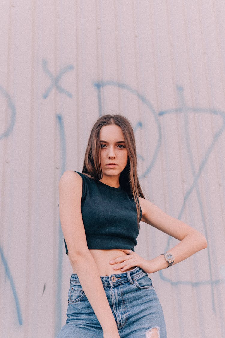 Cool Woman In Casual Wear Against Metal Wall