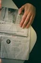 A Hand on a Newspaper