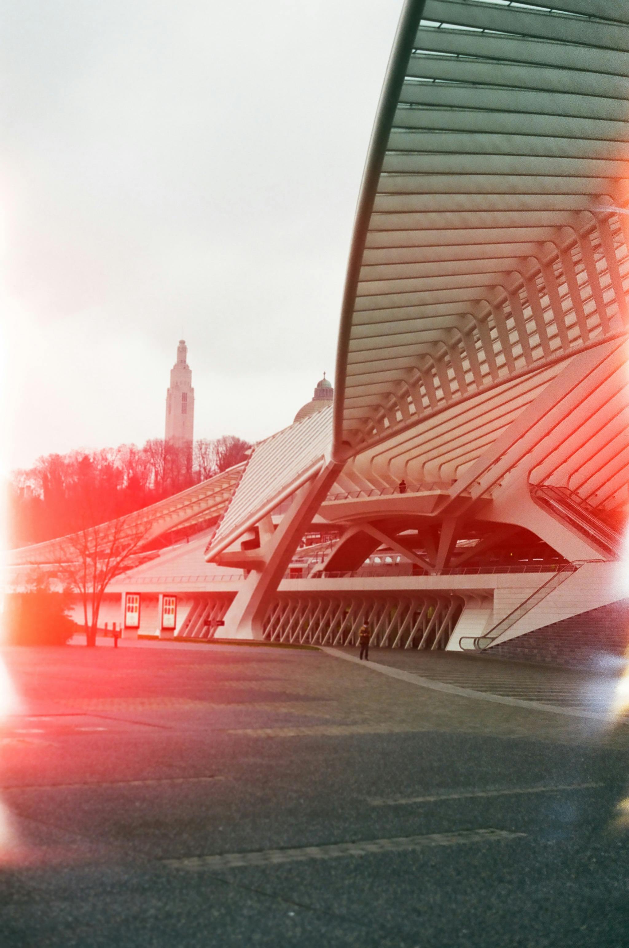 Contemporary architectural design in Liège, Belgium, with artistic light leak effect enhancing urban ambiance.