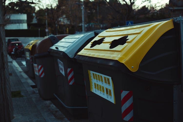 Close-Up Shot Of Trash Cans