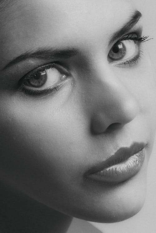 Close-Up Shot of a Woman Looking at the Camera 