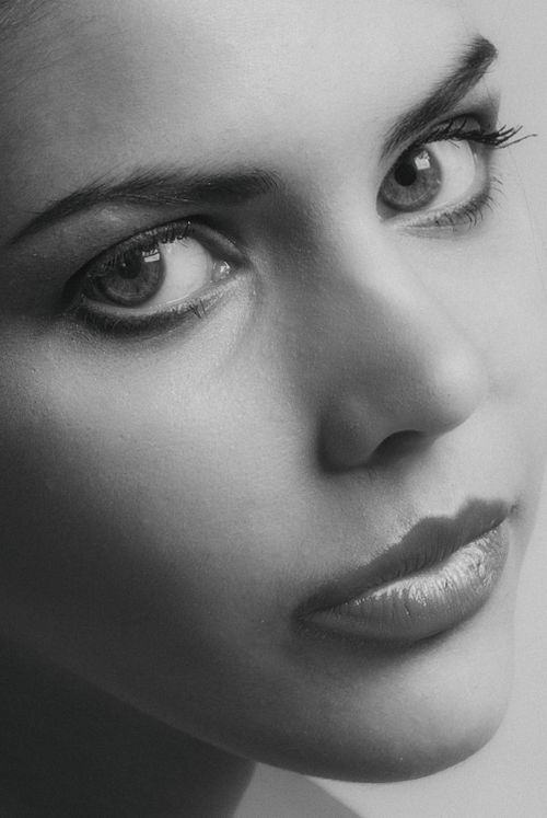 Free Close-up grayscale portrait of a woman with intense gaze, emphasizing facial features. Stock Photo