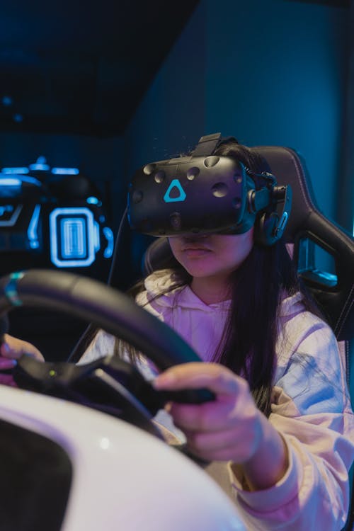 Woman Wearing a VR Headset while Playing a Video Game