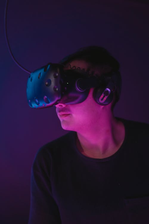 Man Wearing a Black Shirt Wearing a VR Headset