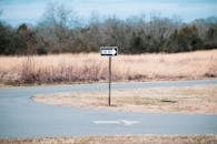 One Way Sign on Grass