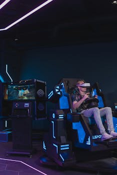 Man engaged in immersive virtual reality gaming at an arcade with VR headset and racing simulator chair.