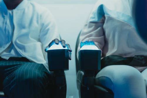 People Sitting on Virtual Reality Simulator