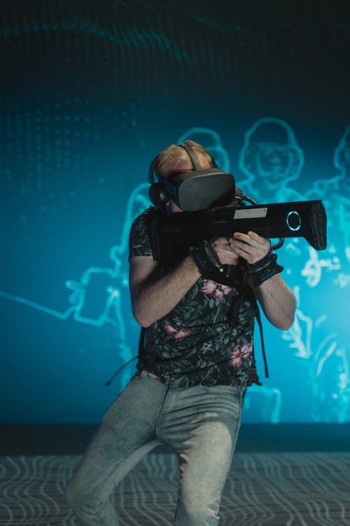 Man Playing a Video Game while Wearing a VR Headset