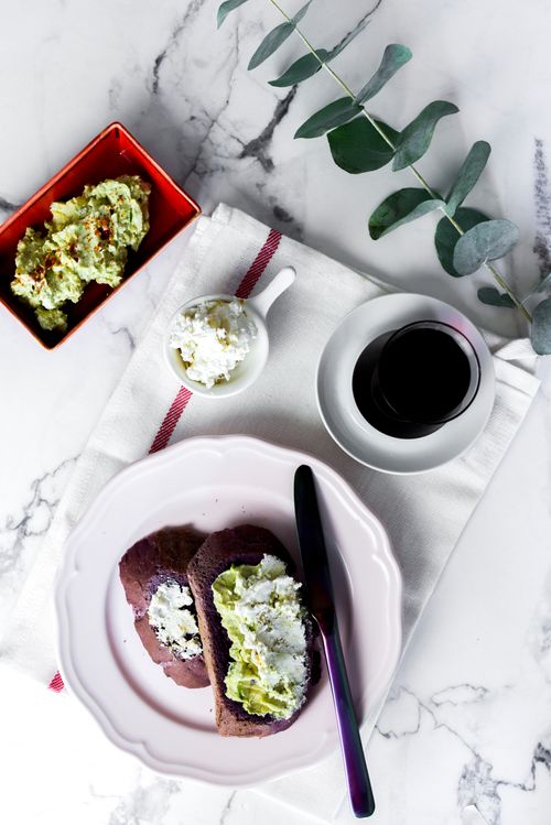 Free Start your day with delicious avocado and cream cheese toasts paired with a glass of coffee. Stock Photo