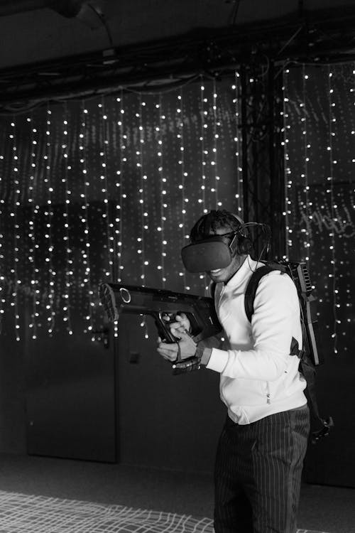 Free Grayscale Photo of Man Playing a Virtual Reality Game Stock Photo