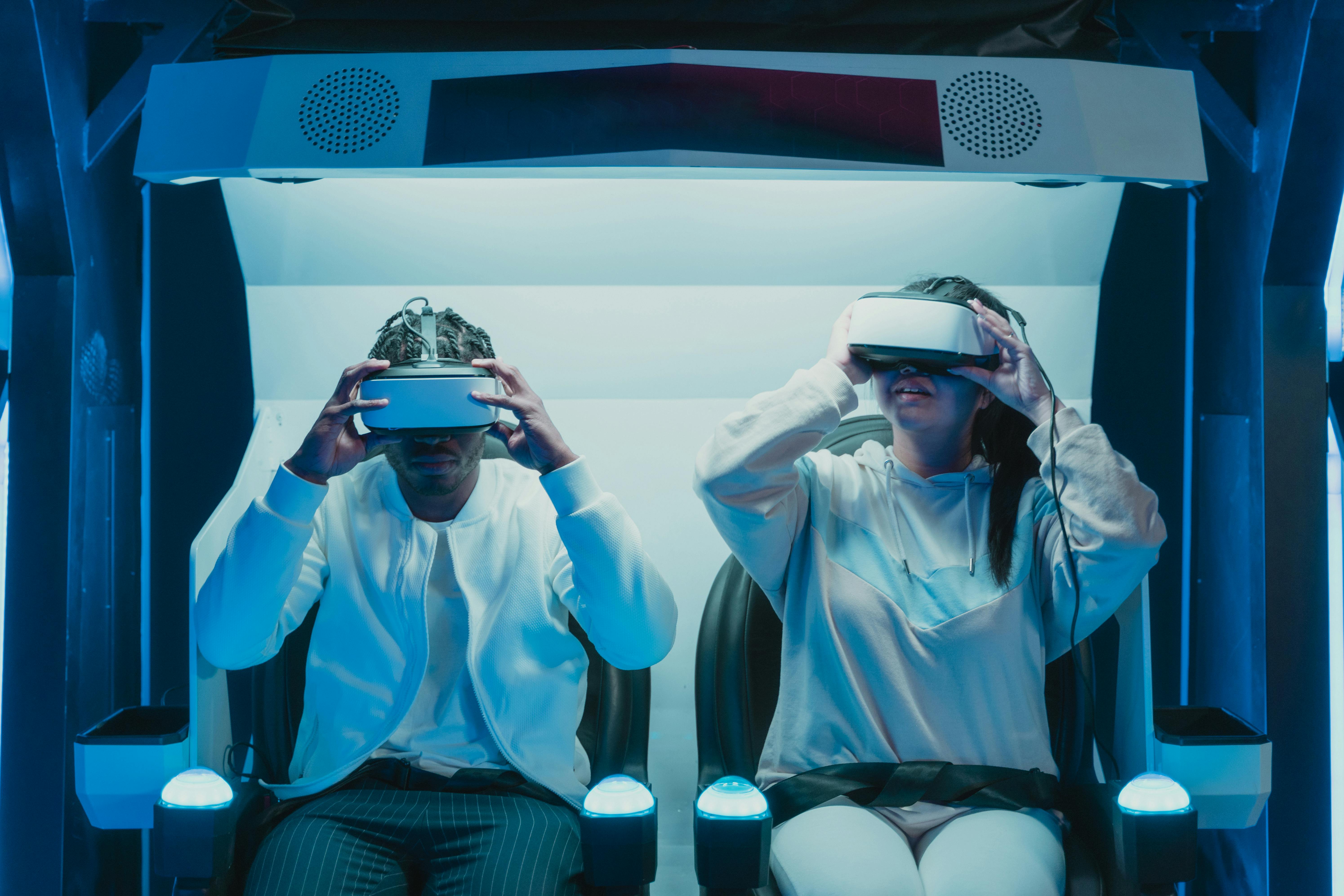 two people playing virtual reality glasses