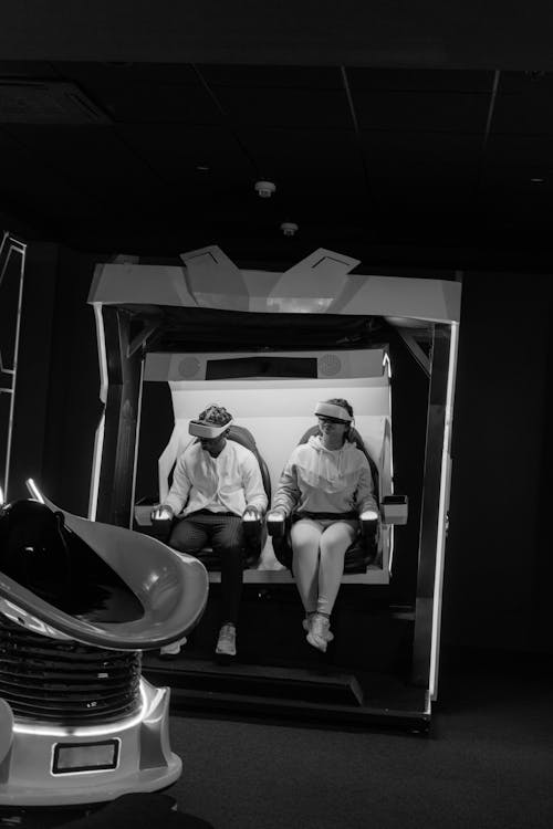 Grayscale Photo of Two People Playing Virtual Reality Glasses