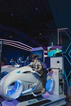 A child enjoying a virtual reality motorbike simulator ride at an indoor arcade.