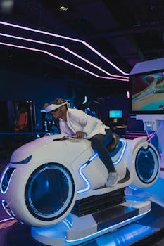 Man immersed in virtual reality gaming ride wearing a VR headset in a futuristic setting.