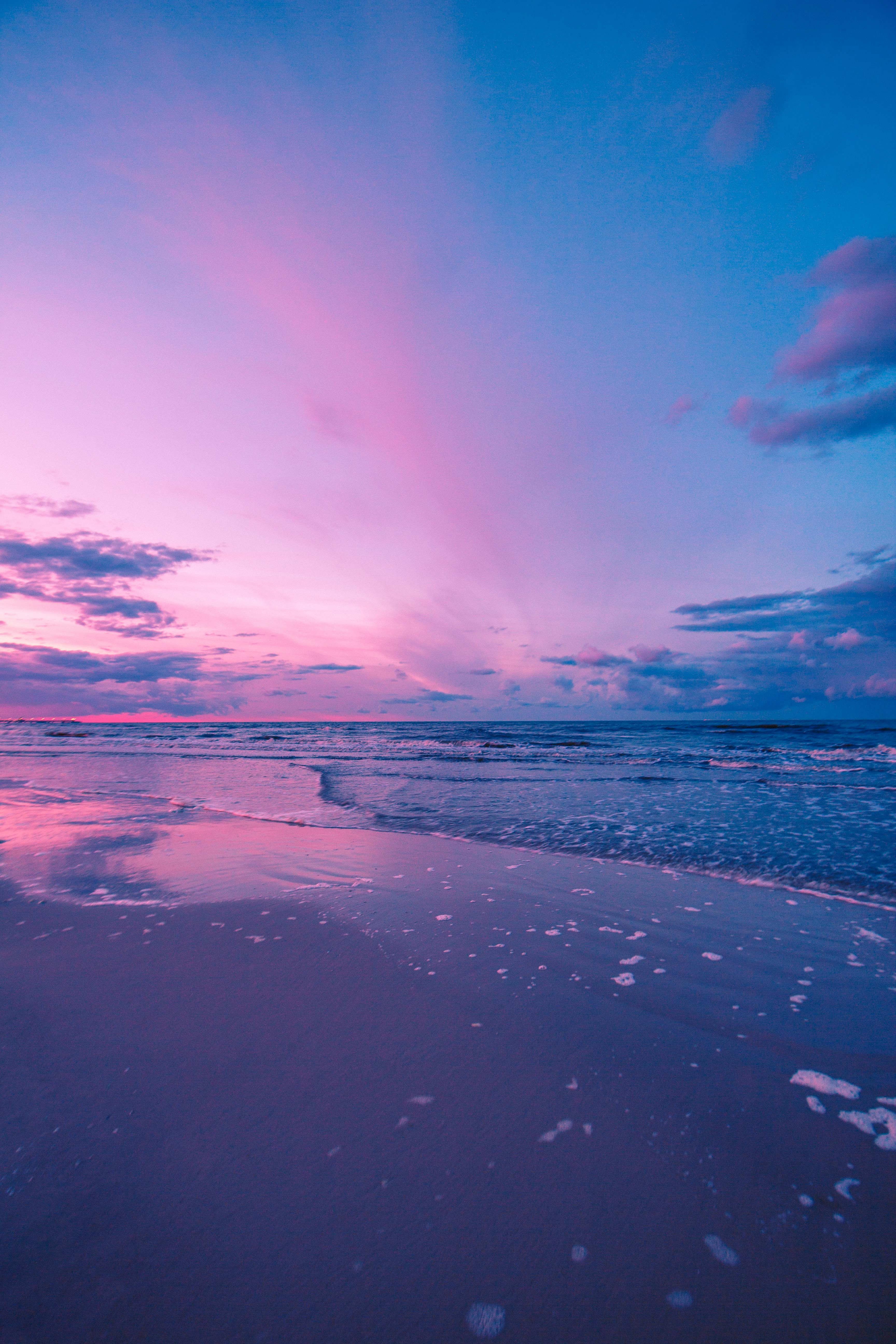 Tranquil seaside view at sunset in Heringsdorf, Germany, featuring soft pastel hues.