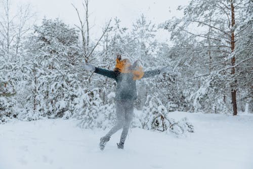 Free Woman Playing with Snow Stock Photo