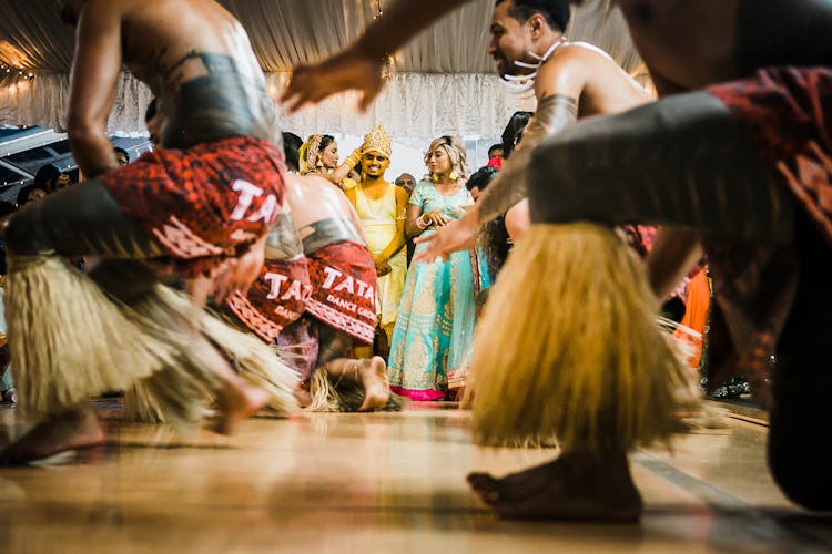 Happy Indian Newlyweds With Guests Enjoying Dance Show During Wedding Party