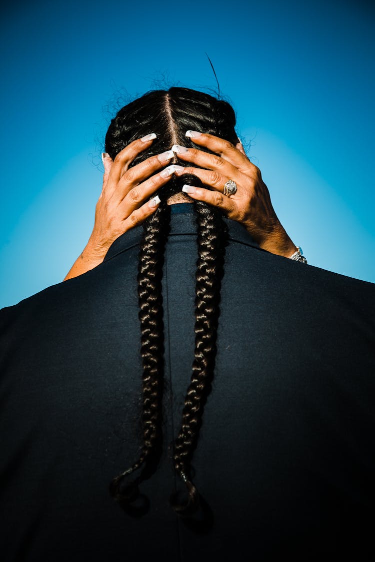 Woman With Long Nails Hugging Person With Braids