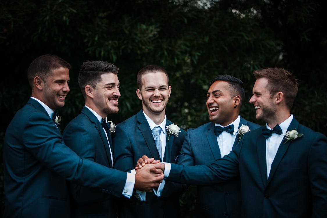 Happy groom with groomsmen, formal wedding attire, wedding guest dress code, formal dress code, formal attire