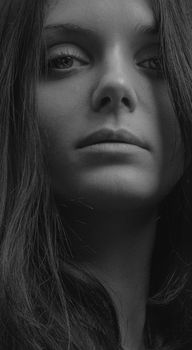 Grayscale close-up portrait of a woman with deep expression in Kyiv, Ukraine.