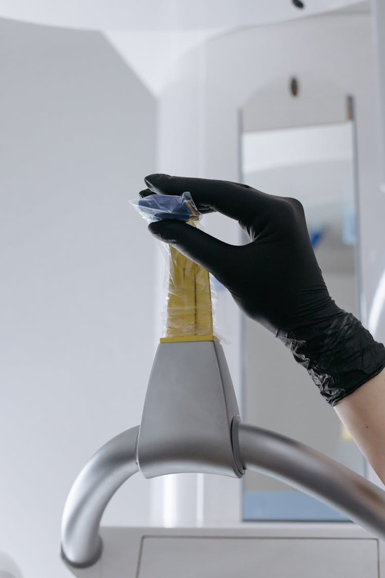 Close-Up Shot Of A Person Holding A Dental Equipment