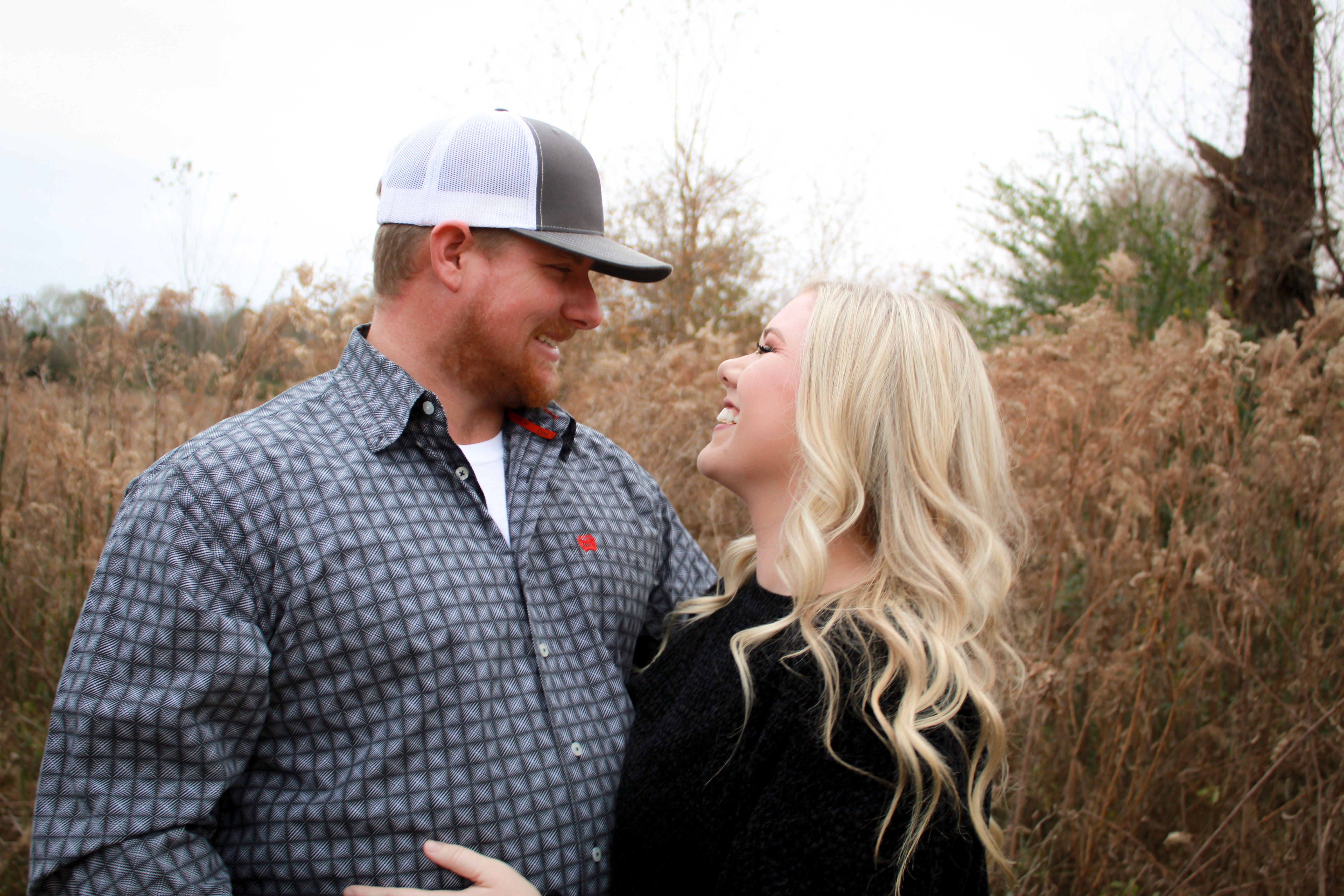 A couple sharing a joyful moment in nature, exuding love and happiness.