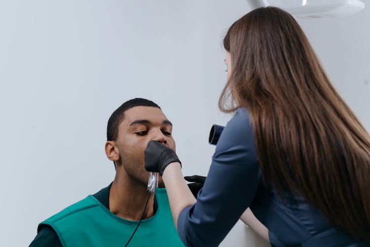 A Man Having A Dental Checkup