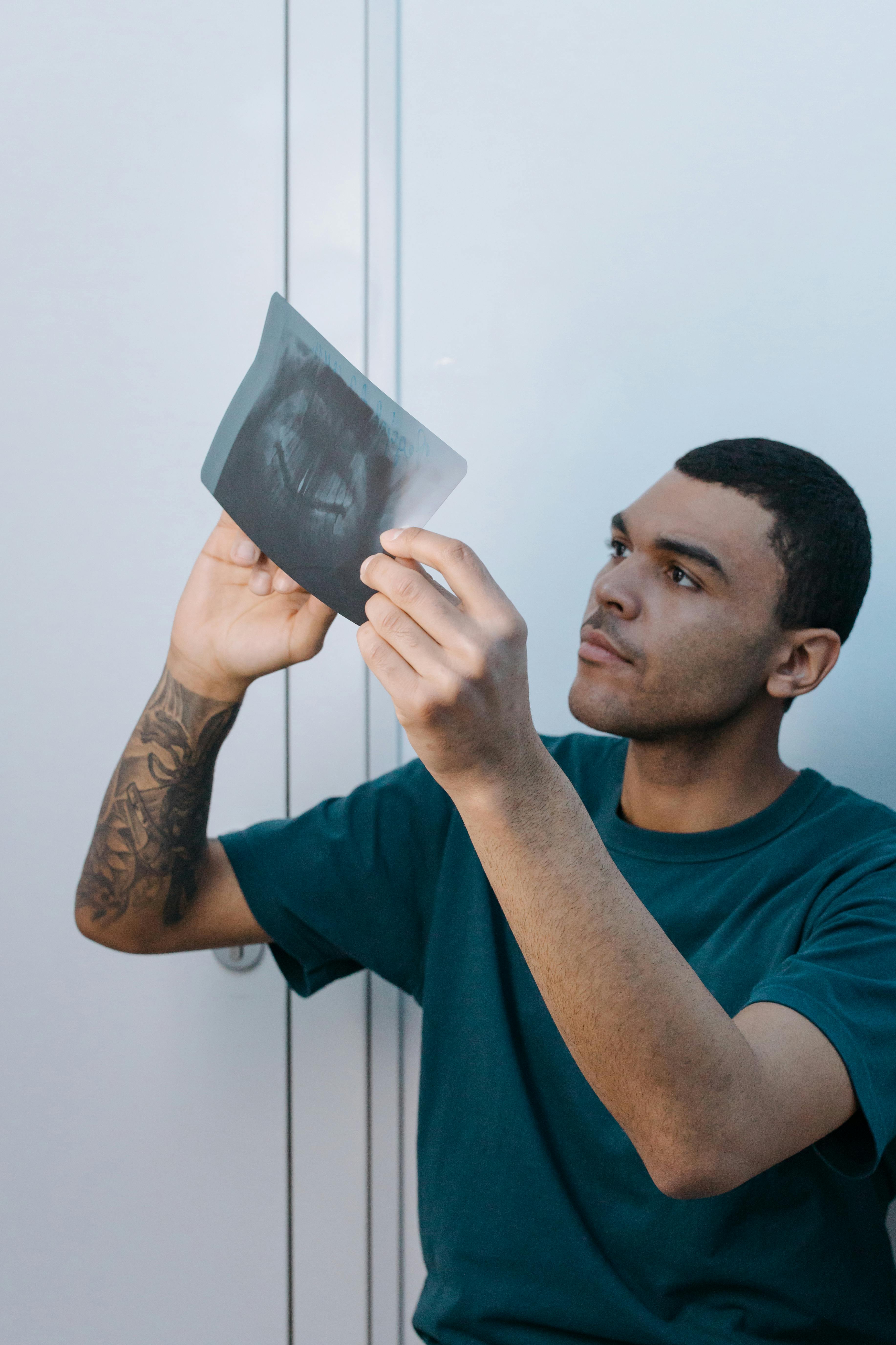 a man looking at an x ray image