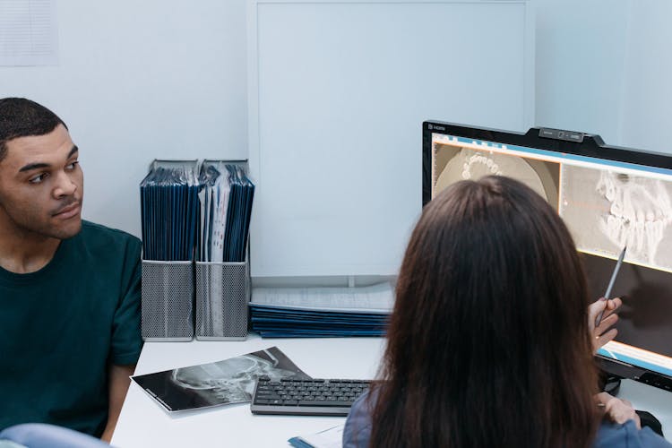 A Man Having A Dental Consultation With A Dentist