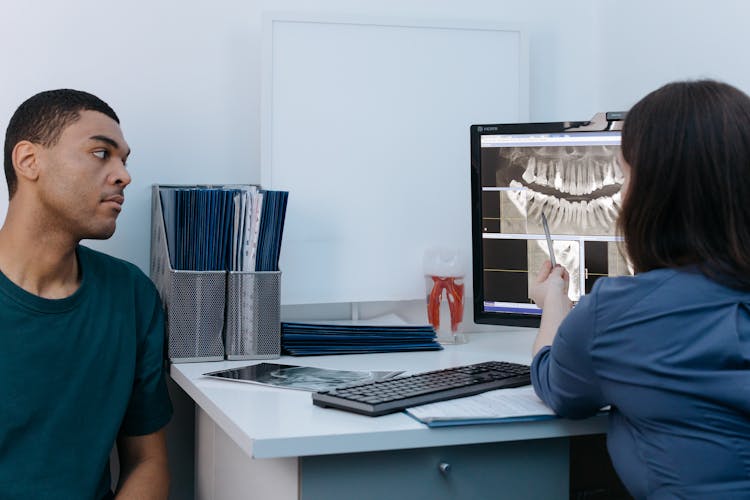 A Man Having A Dental Consultation With A Dentist