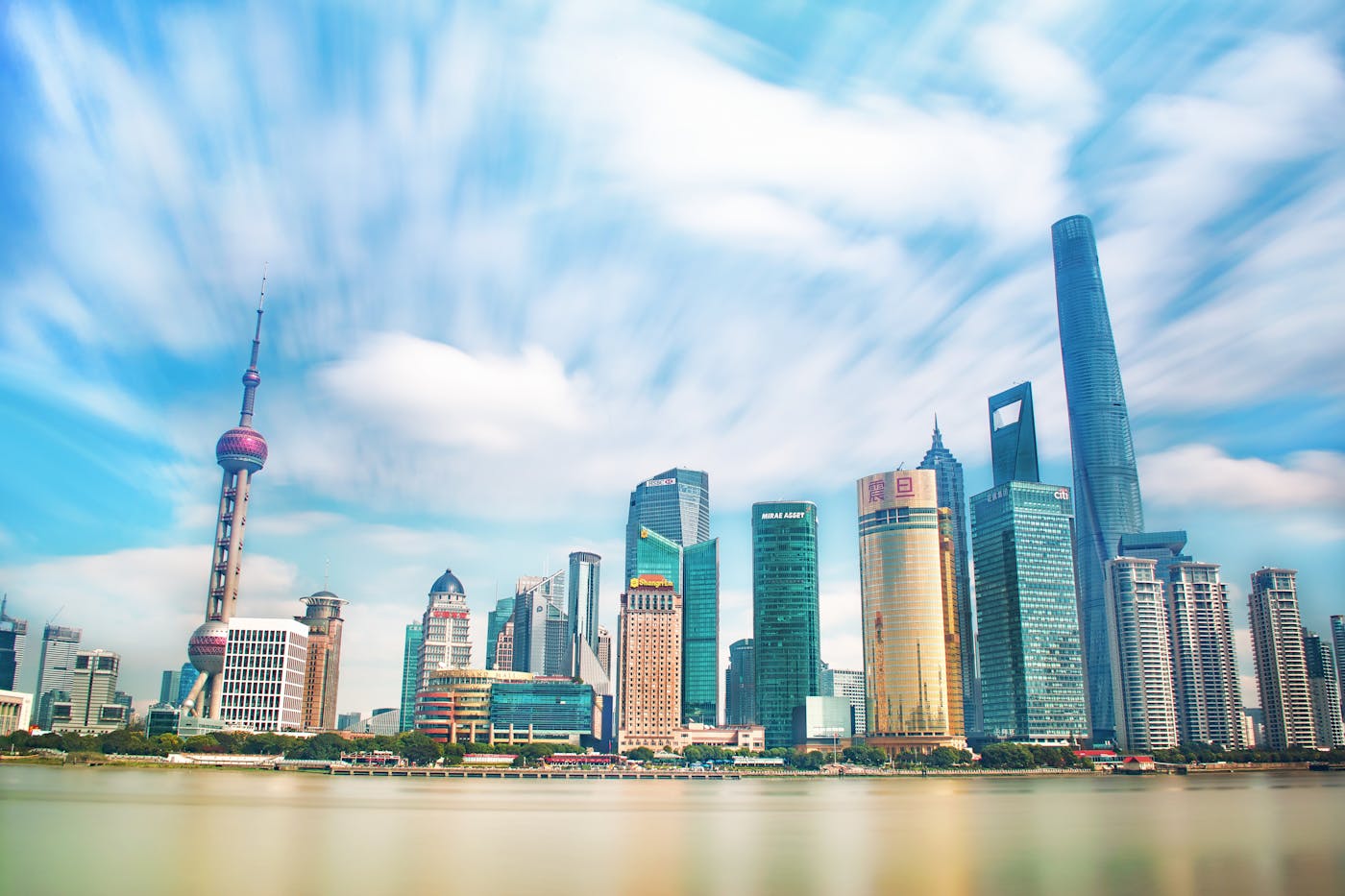 Shanghai city center skyline along the Huangpu River with iconic Pudong skyscrapers