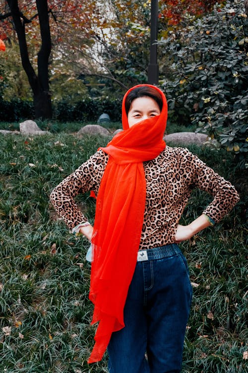 Woman Wearing Red Scarf and Leopard Print Shirt