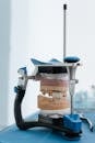 Close-Up Shot of a Denture Being Fitted in a Dental Equipment