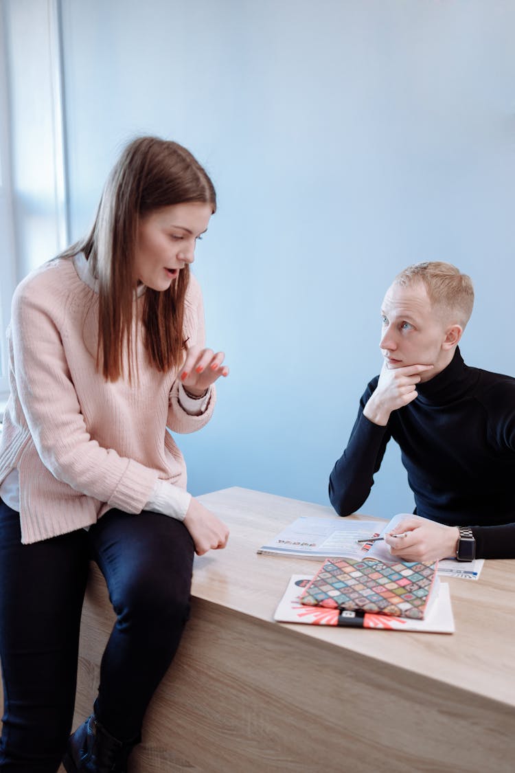 A Female Teacher Tutoring Her Male Student