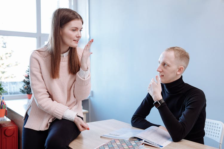 A Female Teacher Tutoring Her Male Student