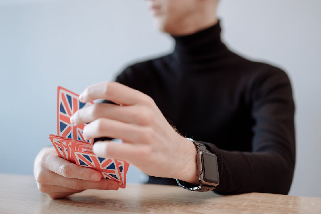 Close-Up Shot of a Person Playing Card Game