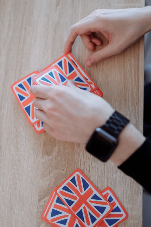 Close-Up Shot of Person Playing With Cards